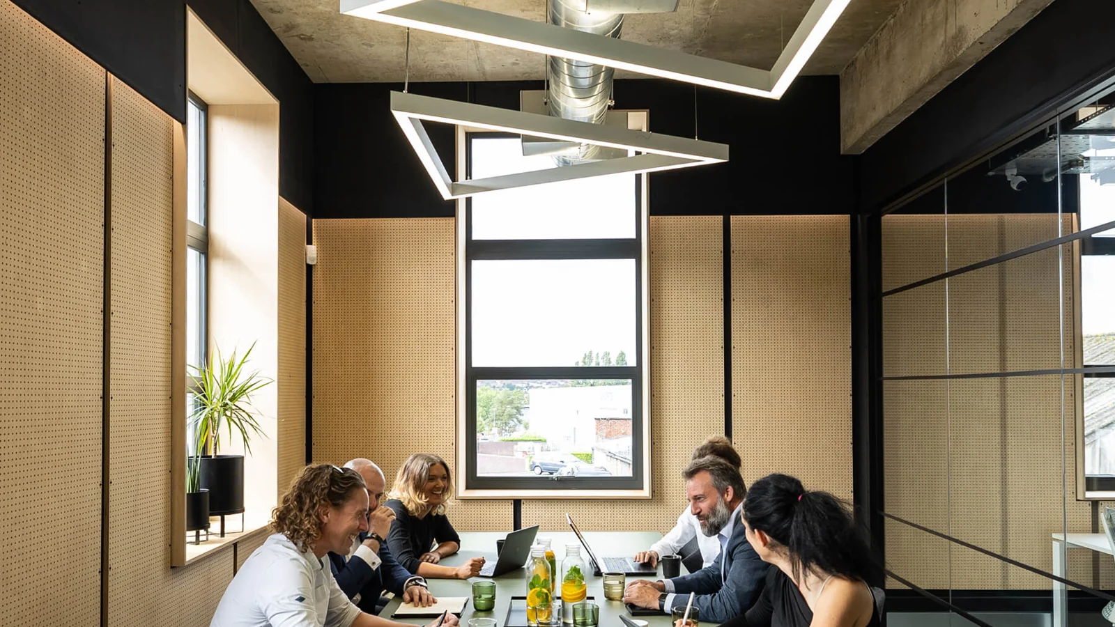 Light Engineers discussing a lighting project in an office